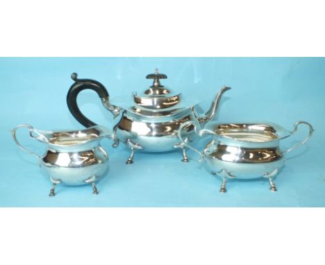 A three-piece tea service of oval bellied form, on four hoof feet, (one a/f), total weight ___20oz.