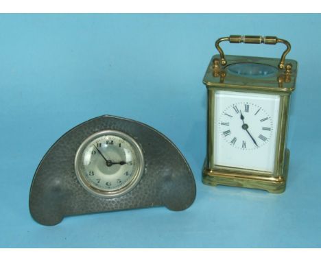 A 'Homeland' pewter small mantle clock of Art Nouveau style, 9.5 x 15cm and a French brass carriage timepiece, (table replace