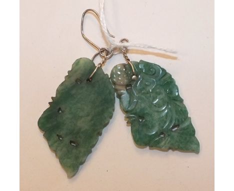 A pair of carved jade plaques mounted as earrings, with wire fish hook fittings, plaques 4.4cm long, (2).