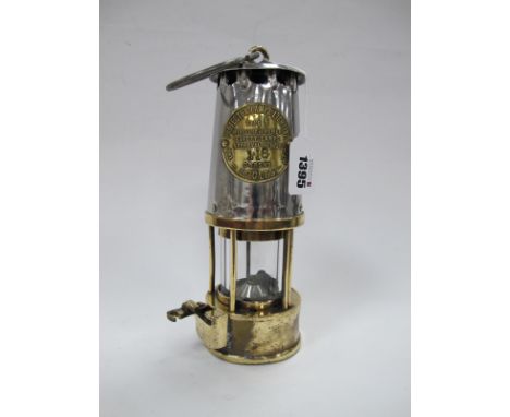 Miners Lamp, The Protector of Eccles, No. 116 to makers plaque, with brass lower body, 23.5cm high with handle down.