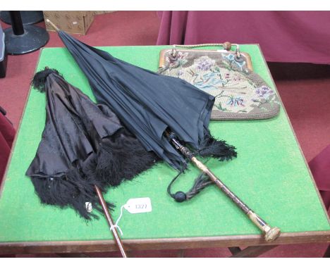 An Early XX Century Tapestry Handbag, with wooden frame and cord handles; a ladies mourning umbrella with bamboo and gilt met