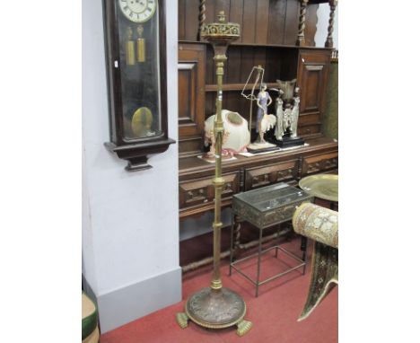 A XX Century Brass Copper Adjustable Standard Lamp, with a turned reeded column, on a circular base, gadrooned feet.