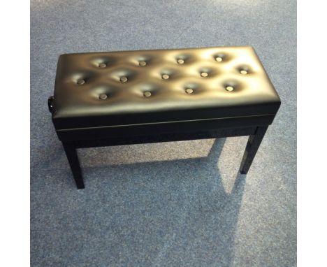 Piano Stool A duet adjustable piano stool in a bright ebonised finish with storage under a button leather top. 