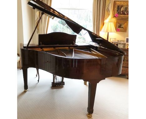 Blüthner (c1990) A 5ft 1in Model 11 grand piano in a bright mahogany case on square tapered legs; together with a stool.