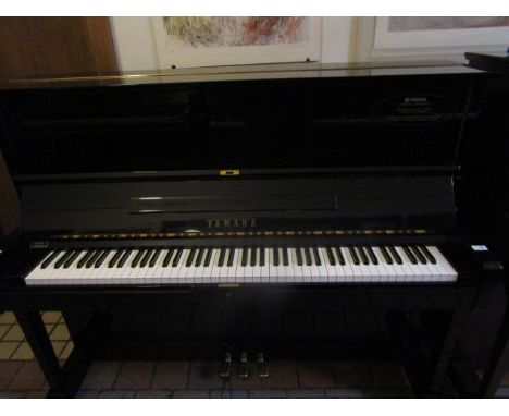Yamaha (c1974)  A Model U1 upright piano in a bright ebonised case.