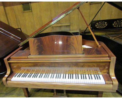 Blüthner (c1982) A 6ft 3in Model VI grand piano in a bright mahogany case on square tapered legs.
