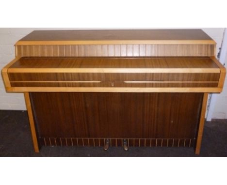 Kemble (c1956) A Mini Minx upright piano in a late Art Deco/fifties style case with light and dark contrasting woods with pla