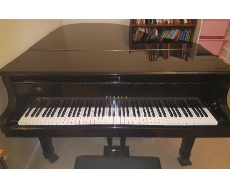 Yamaha (c1980)A 6ft 1in Model C3 grand piano in a bright ebonised case on square tapered legs; together with a matching stool