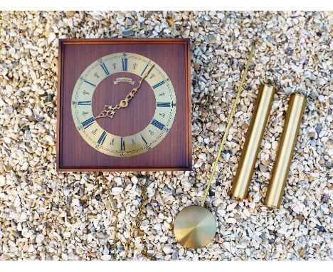 A German weight driven wall clock, Roman numerals on a brass chaper ring, the dial marked Schmeckenbecher, with pendulum and 