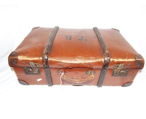 A vintage leather and wood suitcase