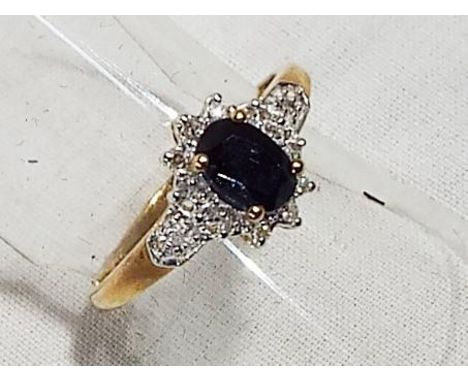 A lady's 9 carat yellow gold black sapphire and diamond cluster ring, size O, approx 1.4 gm (all in) - Est £20 - £40