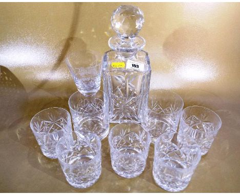 A heavy good quality glass decanter with seven matching glasses and a Wedgwood drinking glass commemorating Liverpool and Man