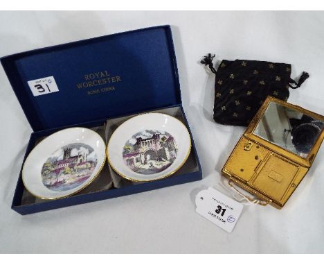 A musical powder compact marked Mascot ASB in soft pouch, and a pair of Royal Worcester pin dishes, boxed - (2)