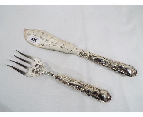 A white metal fish knife and fork, cased and a collection of flatware, predominantly silver presumably hallmarked
