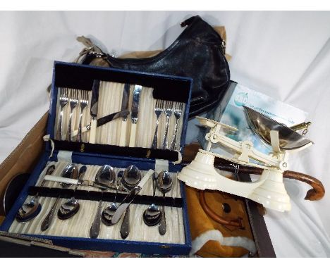 A good mixed lot to include a weighing scale, a canteen of cutlery, handbags, vintage linen, walking stick and other