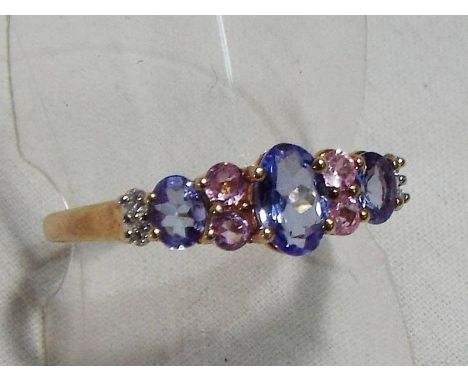 A lady's yellow metal ring stamped 375 and 9K with maker's mark set with tanzanite, pink sapphire and diamonds, approx weight