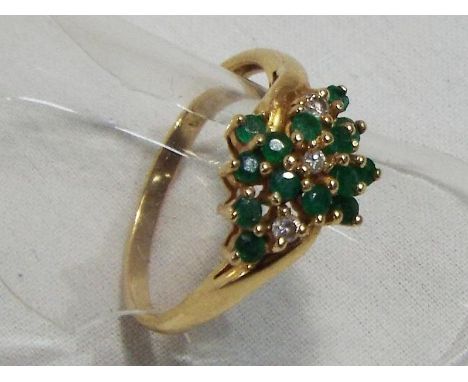 A lady's hallmarked 14 carat yellow gold emerald and diamond ring, approx weight 3.04 gm (all in) size N + 1/2