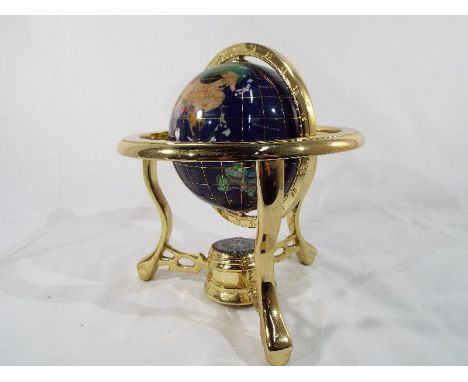 A small lapis lazuli world globe in ornamental stand approximately 20 cm (h)