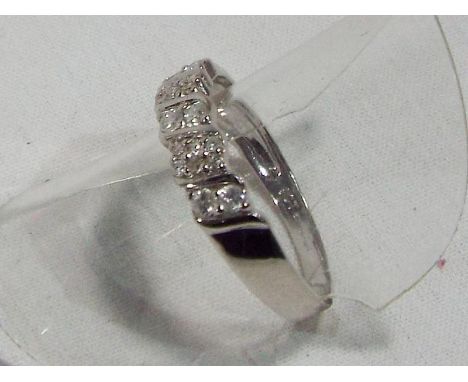 A lady's hallmarked 9 carat white gold ring set with cz, approx weight 2.07 gm (all in) size O + 1/2