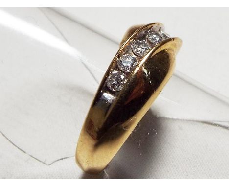 A lady's yellow metal ring stamped 10KT set with 0.35 ct of diamonds, approx weight 5.18 gm (all in) size K + 1/2
