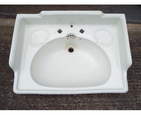 A Victorian Oceanic ceramic bathroom sink with cast iron support, dimensions of sink 33 cm x 69 cm x 50 cm