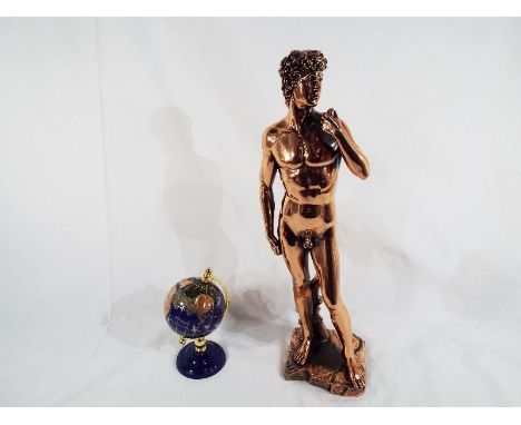 A small lapis lazuli globe 15 cm (h) and a figure depicting a naked man 41 (h) (2)