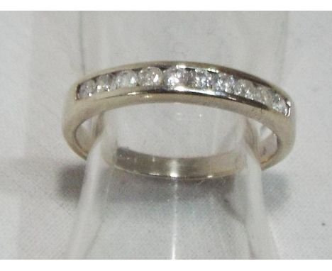 A lady's hallmarked 9 carat gold 0.25 carat diamond half eternity ring, approx weight 1.52 gm (all in) size H + 1/2, boxed