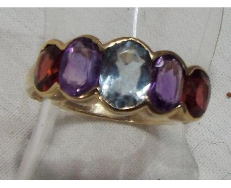 A lady's hallmarked 9 carat yellow gold ring set with topaz, amethyst and garnet, approx weight 2.62 gm (all in) size L + 1/2