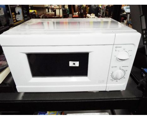 A microwave, unused with operating manual