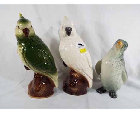 Three ceramic figurines depicting birds