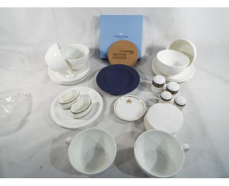 A collection of 23 pieces of Concorde memorabilia to include Royal Doulton and Wedgwood plates, cups and saucers, two napkin 