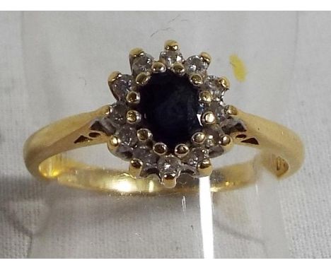 A lady's 15ct gold ring set with sapphire and diamond surround, size N, approx weight 2.99grams (all in) Est £30 - £60