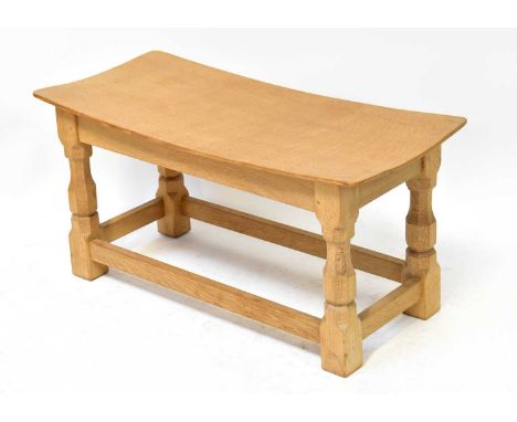 THE WORKSHOP OF ROBERT 'MOUSEMAN' THOMPSON; a 1980s light oak stool with rectangular top, on carved block legs united by a st