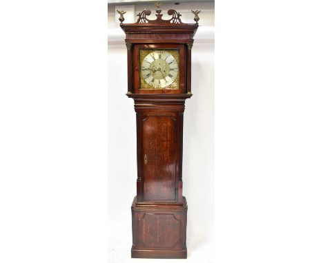 THOMAS RICHARDSON, WEAVERHAM; a Georgian oak cased eight-day longcase clock with fret carved scrolling pediment set with thre
