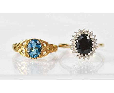 Two 9ct gold rings, one set with single blue stone to pierced Celtic inspired shoulders, size N1/2, the other with central sa