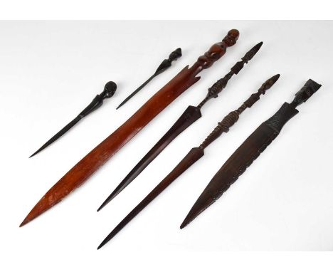 A collection of African carved items to include spears and a dagger (6).