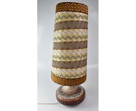 A 1970s West German style ceramic table lamp with oversized conical stitched decorated shade, height 70cm.Condition Report: -