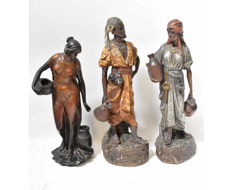 Three painted plaster Eastern figures of water carriers, height of largest 67cm (3).Condition Report: There are chips through