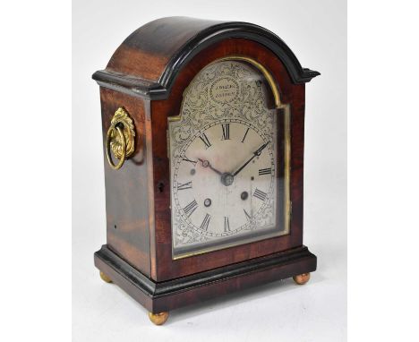 J. WELLER, LONDON; a mahogany cased single fusee mantel clock, the silvered dial set with Roman numerals, height 27cm.  Condi