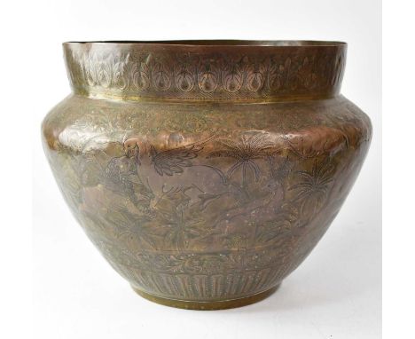 A Benares embossed and engraved brass bowl depicting lions hunting animals in a landscape, height 25cm, together with a simil