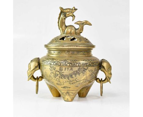 An early 20th century Chinese bronze censer, the pierced lid set with dragon finial, the body with incised decoration and ele