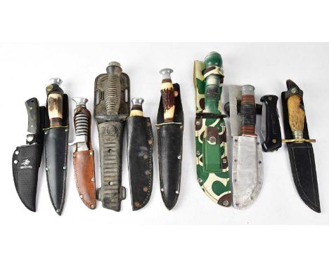 A group of ten various hunting, game, fishing and scout knives, comprising a survival knife with compass to the pommel and co