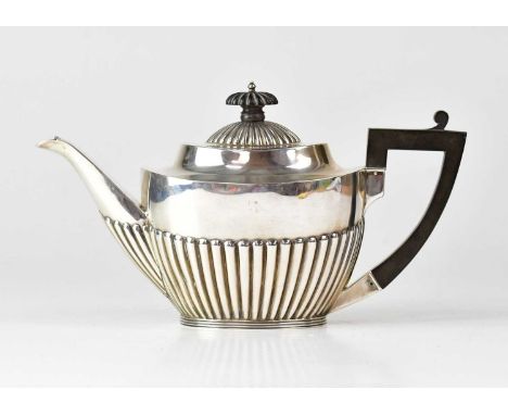 MAPPIN &amp; WEBB; an Edwardian hallmarked silver teapot with gadrooned decoration and ebonised handle, Sheffield 1906, appro