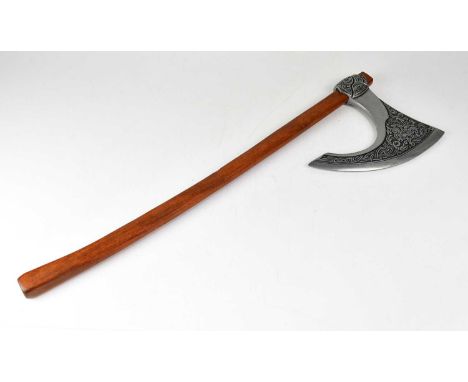 A re-enactment battle axe with relief moulded decoration, overall length 82cm.Condition Report: - Please note that this lot i