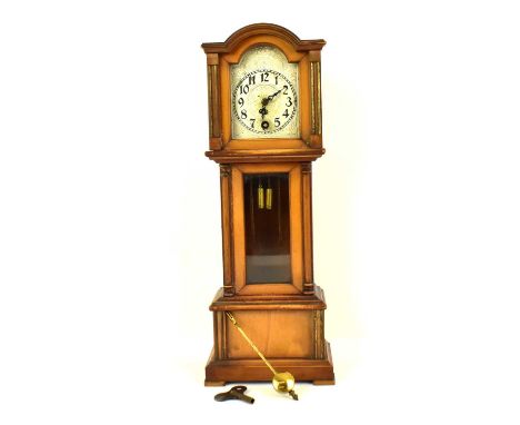 A vintage mahogany cased miniature longcase clock, the silvered dial set with Arabic numerals, with Art Nouveau backplate dec