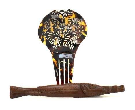 A 20th century pierced tortoiseshell hairclip/comb, 16.5 x 10cm, and an unusual South Pacific carved fish item, unmarked, len
