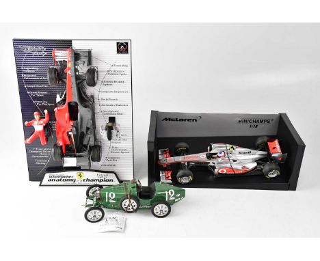 MINICHAMPS; a Vodafone McLaren Mercedes MP4-26 J. Button 2011 racing car 1:18 scale, a CMC 1:18 scale mode of a Bugatti Type 