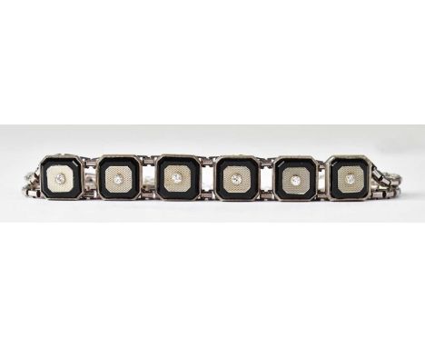 A vintage diamond set bracelet comprising six panels with central bezel set diamond, on an 18ct gold engine turned back withi
