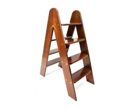 A late 19th/early 20th century set of mahogany folding library steps, with flush brass hinges, three rungs per side and a top