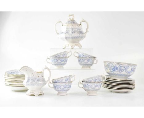 A Chinese-style gilt-heightened blue and white tea service, decorated with a pale blue dragon, comprising a twin-handled lidd